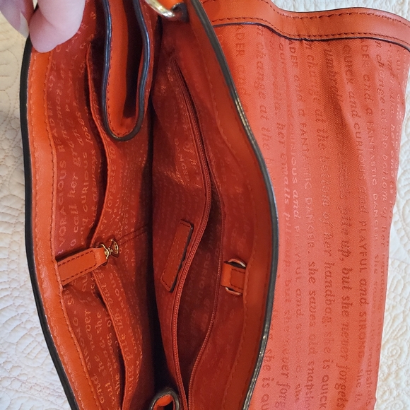 Kate Spade orange leather purse.  12" x 9" Two side zippers three inside pockets - Picture 9 of 11